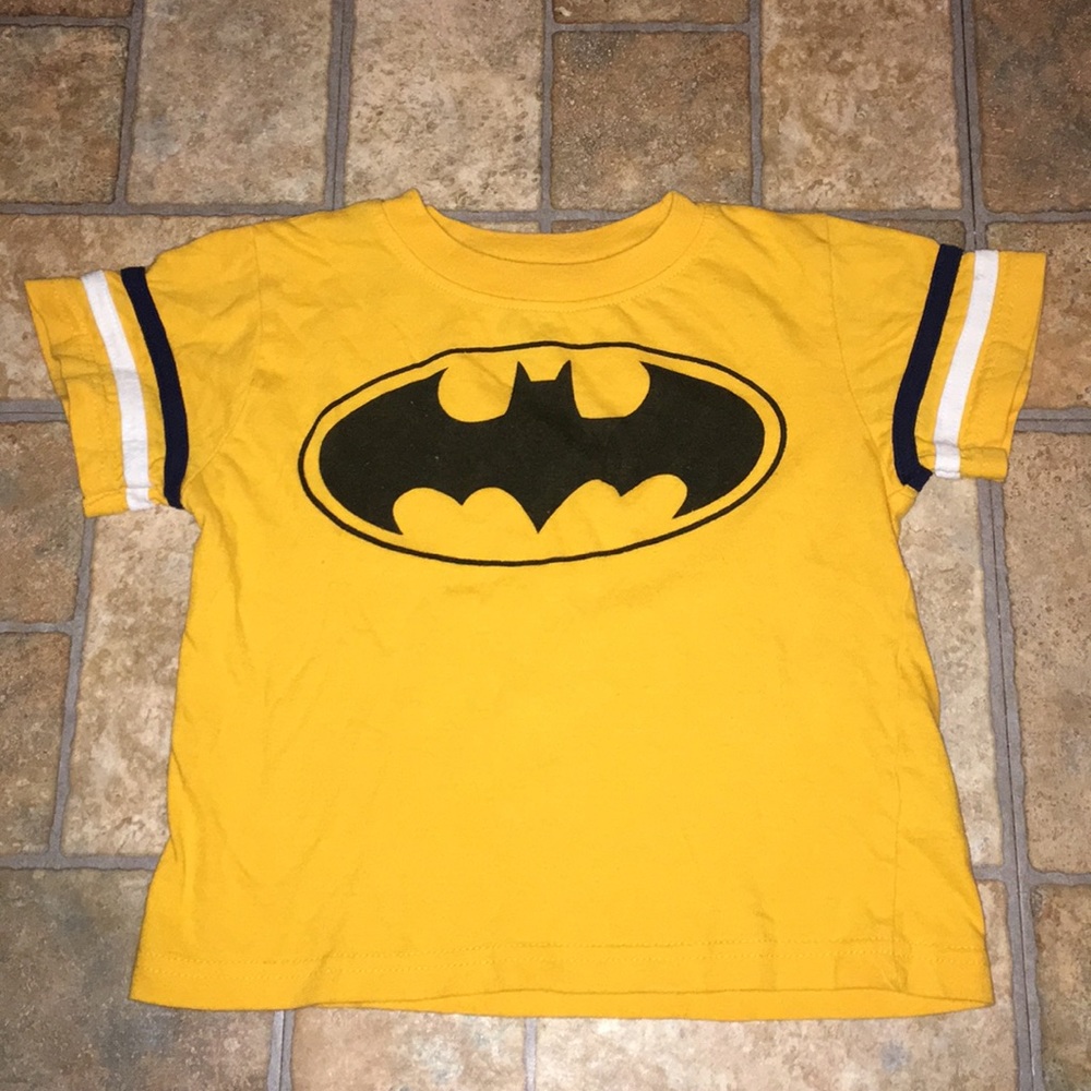 Yellow shirt with Batman symbol on the front
